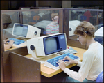 Women Typing at Teleprocessing System Terminals in Cubicles, F by Skip Gandy