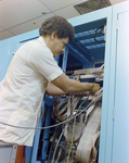 Man Working in Teleprocessing System Mainframe by Skip Gandy