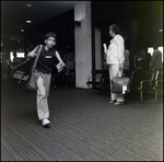 Boy Walking Through Airport