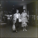 Women Walking Through Airport by Skip Gandy