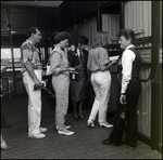 People Walking Through a Door at Airport by Skip Gandy