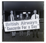 People Holding British Airways Sign, B by Skip Gandy