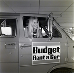 Woman Sitting in Budget Rent a Car, B by Skip Gandy