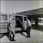 People Standing Outside a Budget Rent a Car, B by Skip Gandy