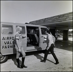 People Standing Outside a Budget Rent a Car, C by Skip Gandy