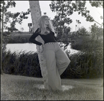 Woman Leaning Against a Tree by Skip Gandy