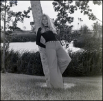 Woman Leaning Against a Tree by Skip Gandy