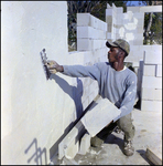 Applying Cement onto Brick Structure, M by Skip Gandy