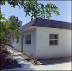 Building Surrounded by Trees and Sidewalks, J by Skip Gandy