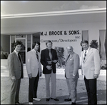 Businessmen in Front of Office Building, F by Skip Gandy