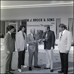 Businessmen in Front of Office Building, G by Skip Gandy