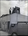 Men on Roof Working with Air Conditioning Unit