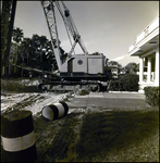 Crane Working in Front of a Building, Tampa, Florida, A by George Skip Gandy IV