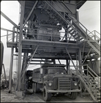 Dump Trucks Being Filled with Asphalt, Tampa, Florida, A by George Skip Gandy IV