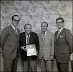 Three Men and John E. Douglas Pose with Agency Development Award, Tampa, Florida, C by George Skip Gandy IV