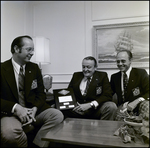 Two Men and John E. Douglas Pose with Agency Development Award, Tampa, Florida, C by George Skip Gandy IV