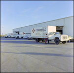 Trucks and warehouse for Consoweld Distributors, Tampa, Florida, A by George Skip Gandy IV