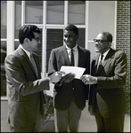 Man Handing a Piece of Paper to Frederick A. Reddy, Tampa, Florida, A by George Skip Gandy IV