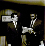 Man Hands Frederick A. Reddy a Framed Item, Tampa, Florida by George Skip Gandy IV