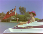 Model Posing on Falcon Royale Boat, A by George Skip Gandy IV