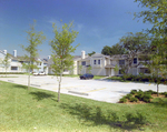 View of Parking Lot and Yellow Apartment Buildings, Calibre Bend Apartments by George Skip Gandy IV