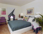 Pink Carpeted Bedroom with Blue and Purple Decor, B by George Skip Gandy IV