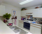 Kitchen with White Cabinets, Calibre Bend Apartments, A by George Skip Gandy IV