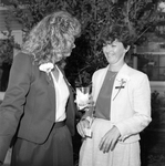 Two Women Professionally Dressed Chatting by George Skip Gandy IV