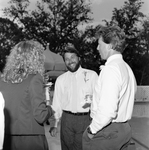 Two Men and a Woman Chatting at a Party by George Skip Gandy IV