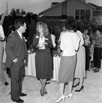 A Woman and a Man Talking at a Party by George Skip Gandy IV