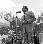 Man Speaking Onstage at a Party, B by George Skip Gandy IV