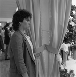 Woman Looking Out with a Curtain Behind Her by George Skip Gandy IV