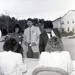 People Signing a Book at a Party by George Skip Gandy IV