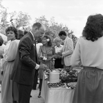 People Gathering Around Buffet Table by George Skip Gandy IV