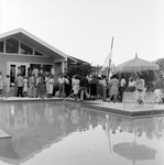 Wide View of People Chatting by the Pool by George Skip Gandy IV