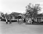 People Gathering in Front of the Information Center, A by George Skip Gandy IV