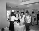 Women Being Served Drinks at a Drink Table by George Skip Gandy IV