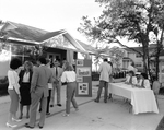 People Gathering in Front of the Information Center, C by George Skip Gandy IV