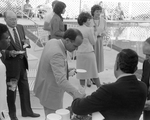 Man in Line at Buffet Table by the Pool by George Skip Gandy IV