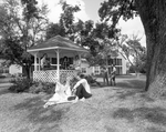 Front View of People Sitting with a Gazebo, A by George Skip Gandy IV