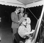 Artist in Medieval Themed Costume Creates a Picture with Onlookers by George Skip Gandy IV