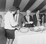 People Lining Up at a Buffet Under a Big Top Tent by George Skip Gandy IV