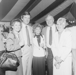 Group of People Posing for Photo at Party Under a Big Top Tent by George Skip Gandy IV