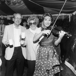 Couple Poses for Photo with Violin Player by George Skip Gandy IV