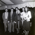 Group of People Smiling for a Photo at a Party by George Skip Gandy IV