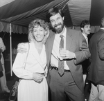 Couple Smiling for a Photo Under a Big Top Tent by George Skip Gandy IV