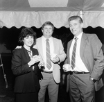 People Smiling for Photo Holding Drinks at a Party by George Skip Gandy IV