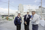 Employees Conversing at a Cargill Fertilizer Inc. Event, A by George Skip Gandy IV