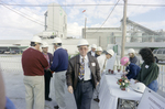 Man Walking Away from Check-In Table at Cargill Fertilizer Inc. Grand Opening by George Skip Gandy IV