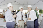 Three Men In Hardhats Conversing at The Cargill Fertilizer Inc. Grand Opening A by George Skip Gandy IV